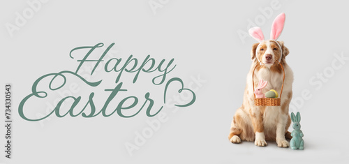 Banner with Australian Shepherd dog with Easter basket of eggs and toy rabbit on light background © Pixel-Shot