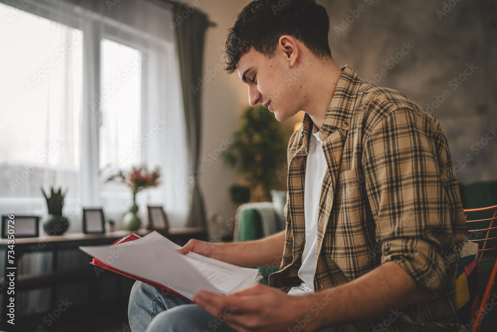 young caucasian man student study at home learn exam or prepare lesson young caucasian man student study at home learn exam or prepare lesson