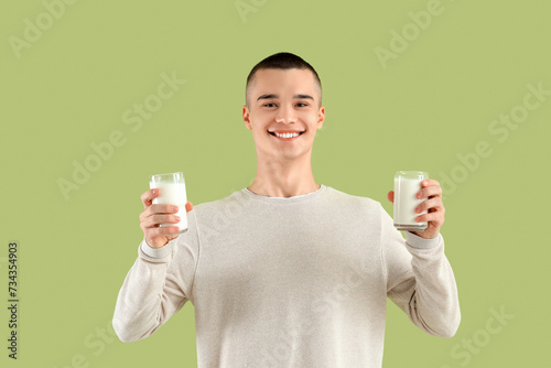 Teenage boy with glasses of...