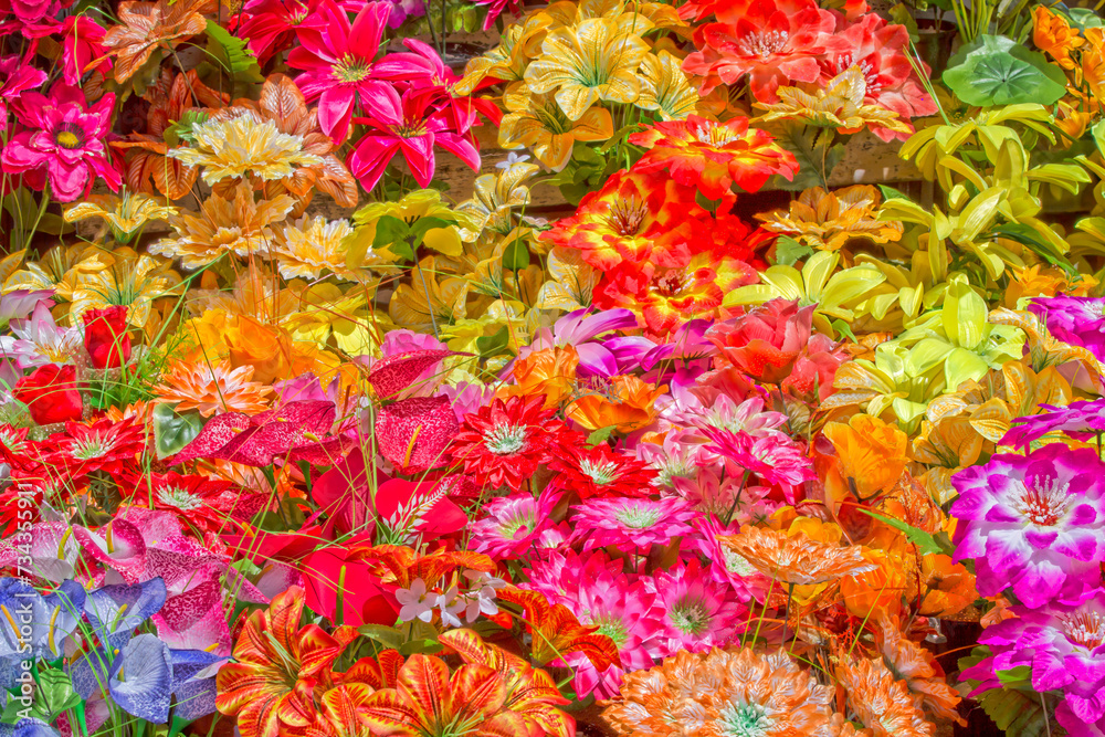 Background of artificial and very colorful flowers Background of artificial and very colorful flowers