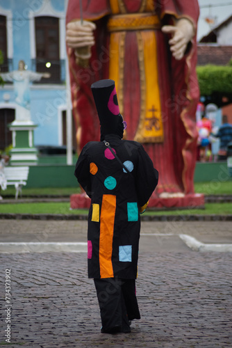 People dressed in different styles are seen playing at the carnival in the city of Maragogipe, in the state of Bahia. photo