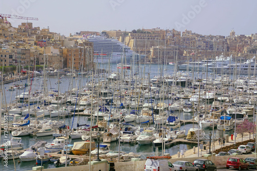 Waterfront marina with yachts and sailboats