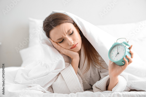 Upset young woman with alar...