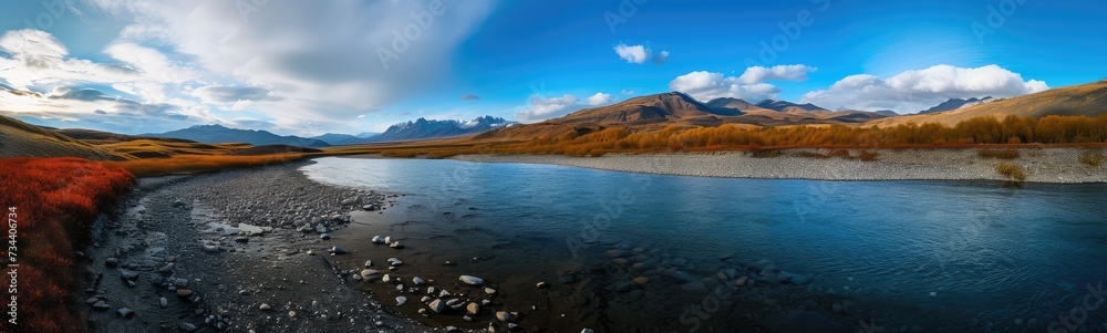 Majestic Autumn River with Mountain Backdrop