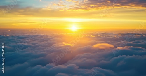 Majestic Sunset Above Soft Cloudscape