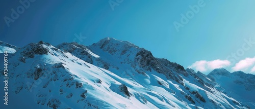 Majestic Snow-Covered Mountain Peaks and Sky
