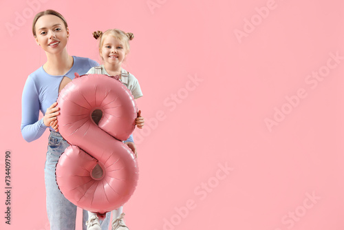 Mother and daughter holding...