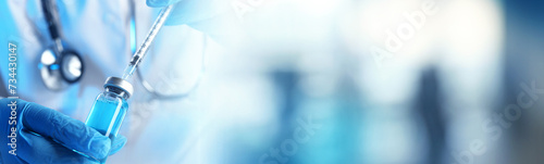 Doctor filling syringe with medication from glass vial on blurred background, closeup. Banner design