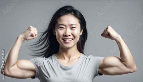 Chinese Woman Flaunting Muscular Arms, a Lovely Smile photo