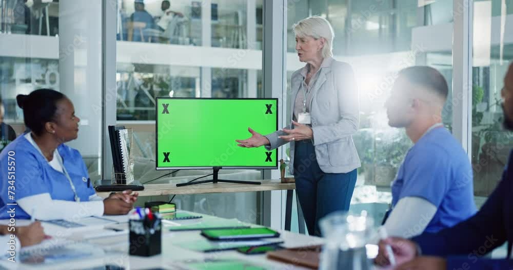Woman, speaker and green screen with nurses for presentation, meeting or collaboration at hospital. Female person or coach talking to medical employees or team on chromakey display or mockup space