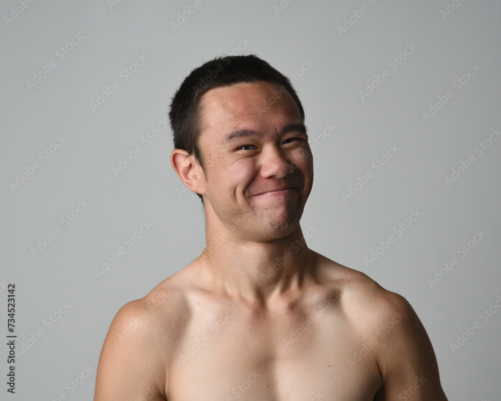 Close up portrait of asian male model, expressive and exaggerated facial expressions and silly faces. Isolated on a white studio background Close up portrait of asian male model, expressive and exaggerated facial expressions and silly faces. Isolated on a white studio background