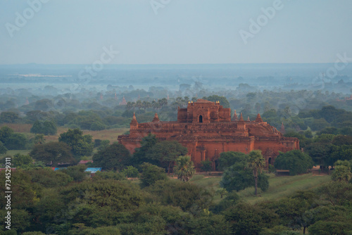 Aerial top view of burmese temples of Bagan City from a balloon, unesco world heritage with forest trees, Myanmar or Burma. Tourist destination.