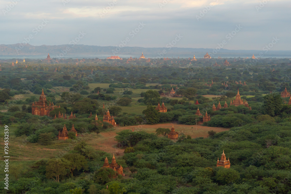 Aerial top view of burmese temples of Bagan City from a balloon, unesco world heritage with forest trees, Myanmar or Burma. Tourist destination.