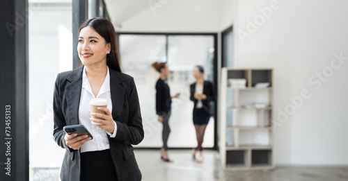 Successful business woman looking confident and smiling photo