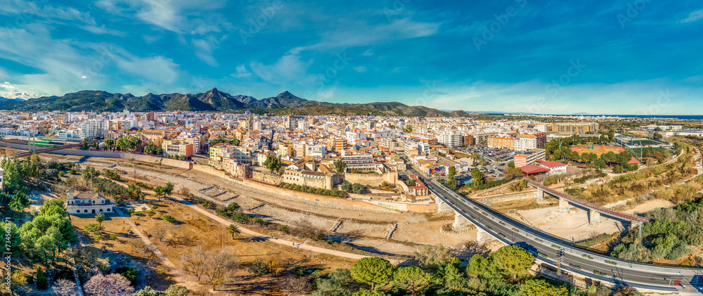 Aerial panoramic view of Gandia, medieval town close to the Mediterranean with Los Borja Ducal Palace, city wall remnants in Spain  Monastery of Sant Jeroni de Cotalba 