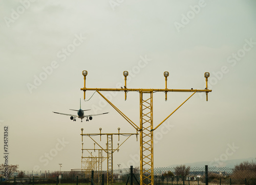 Civilian aircraft in a very cloudy sky to land at the airport	