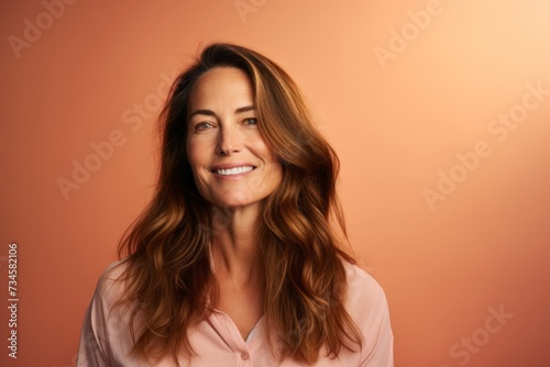 Portrait of a beautiful woman with long brown hair. Studio shot. © Stocknterias