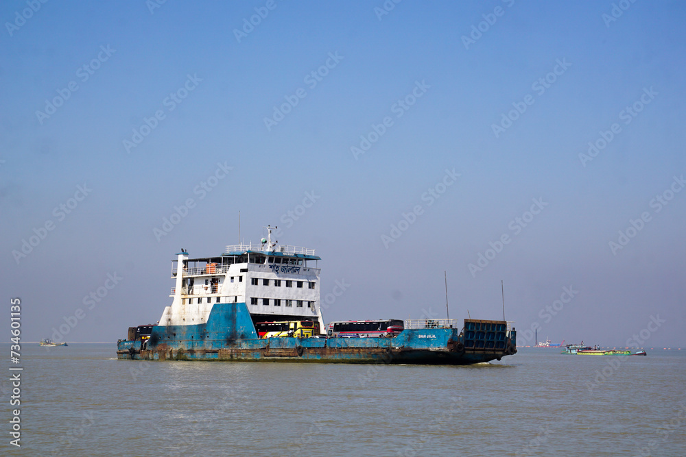 Boat on the River. Bus and people are crossing from one side of the Padma River to the other by ferry. Boat on the River. Bus and people are crossing from one side of the Padma River to the other by ferry.