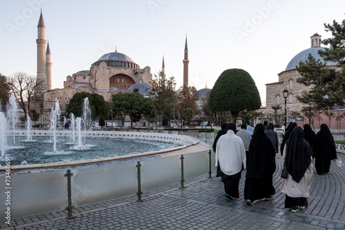 View of Hagia Sophia from Sultanahmet Park in Istanbul, Turkey. Initially a 6th-century church, it underwent transformations into a mosque, then a museum, and was officially reconverted in 2020. photo