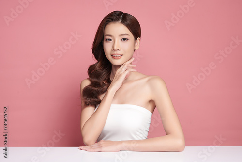 Beautiful young asian woman with clean fresh skin on pink background, Face care, Facial treatment, Cosmetology, beauty and spa, Asian women portrait.