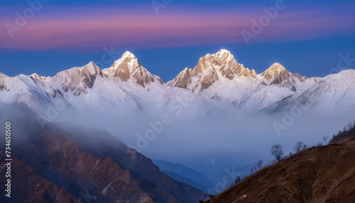 Twilight descends on snow-capped mountains peeking through a blanket of clouds, ai generated. © Rajesh