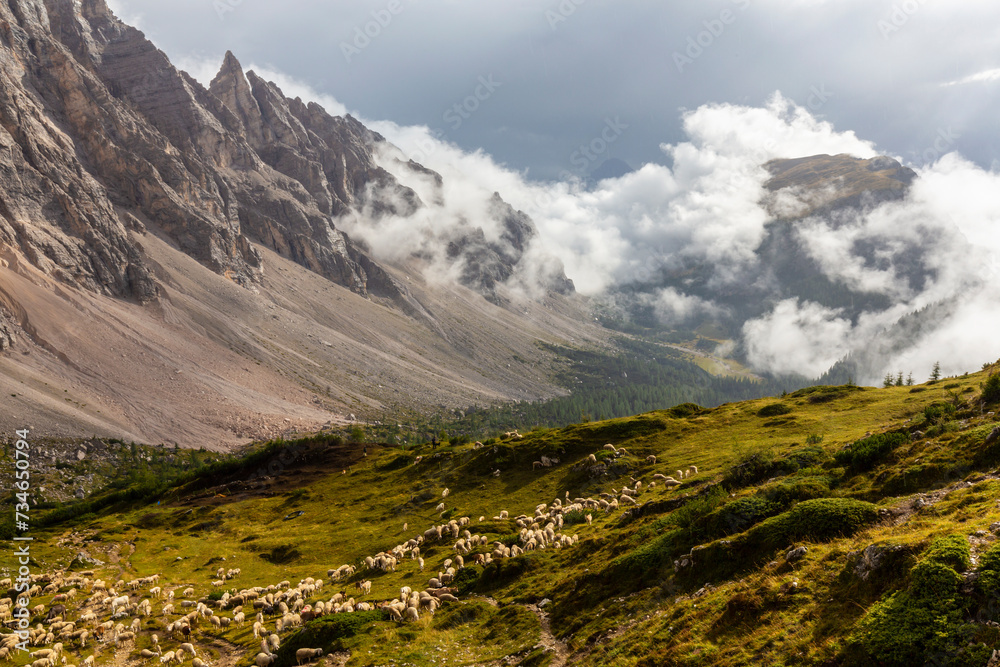 Landscape in the Dolomite Mountains, Italy, in summer, with dramatic storm clouds and Mount Civetta