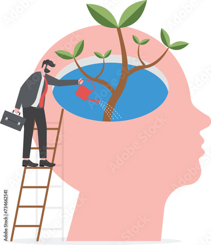 businessman Watering plants with big brain growth mindset concept

