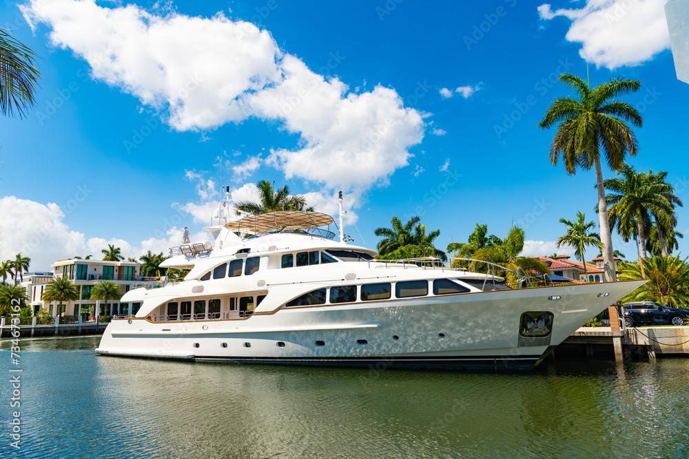 Fototapeta premium Destination point. Harbor with yacht at seaside summer destination. Seaside summer destination with boat and palm in harbor. Seaside harbor perfect destination for summer. Boat trip