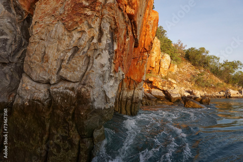 The dark high tide water mark along the cliff walls Talbot bay , Western Australia.