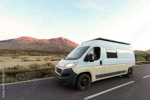 White Van on a Mountain Road at Dusk with Teide volcano in the background
