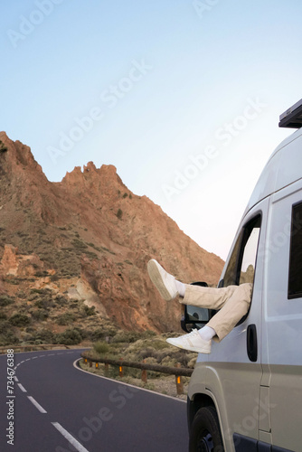 Vertical view of Van Parked Along Mountain Road at Dusk