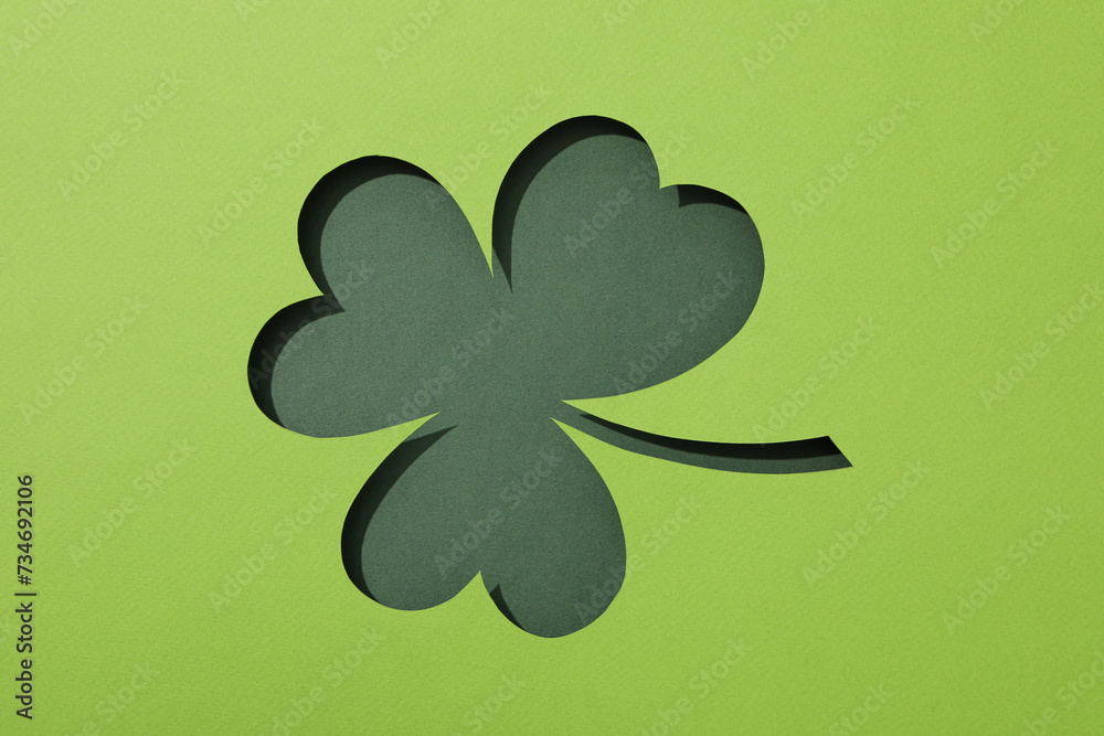 Paper clover leaf on green background, top view Paper clover leaf on green background, top view
