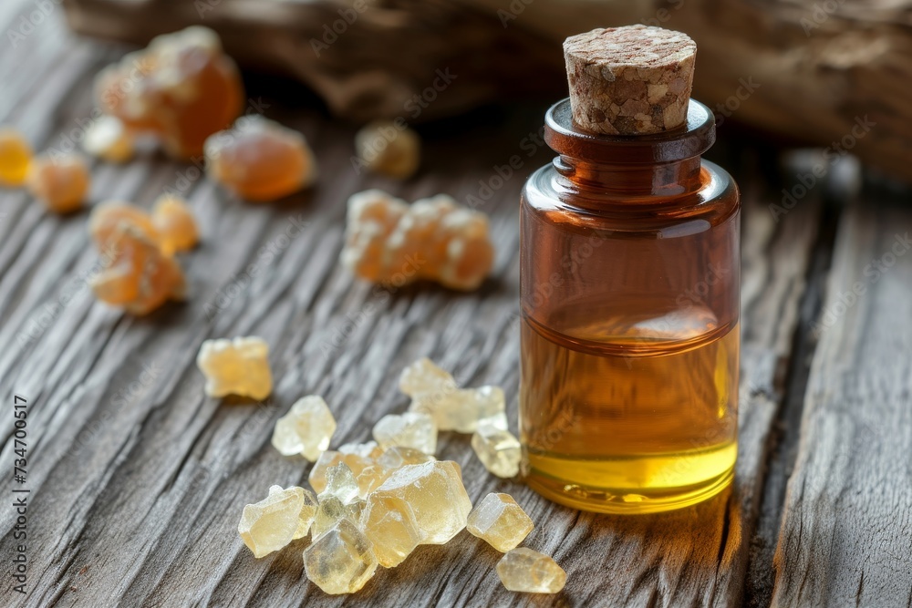 Frankincense resin crystals on rustic background bottle