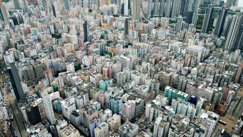 Urban Buildings of Hong Kong City as Big Asia Metropolis on Victoria Island. Cityscape Concept of Over Population in Old China Town. High Scenic Shot on Famouse Kowloon Area in Traditional Central HK