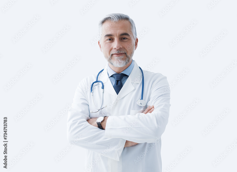 Confident doctor posing and smiling Confident doctor posing and smiling