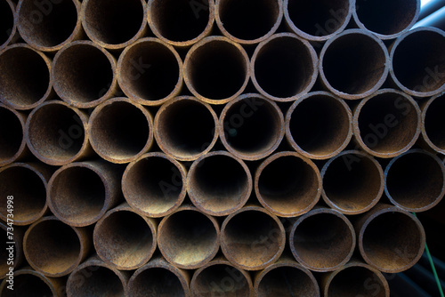 Pile of rusted steel pipes. selective focus