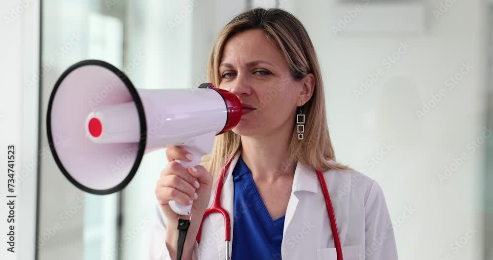 Female therapist delivers announcement through loudspeaker Female therapist delivers announcement through loudspeaker