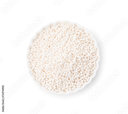 Tapioca pearls in bowl isolated on white, top view