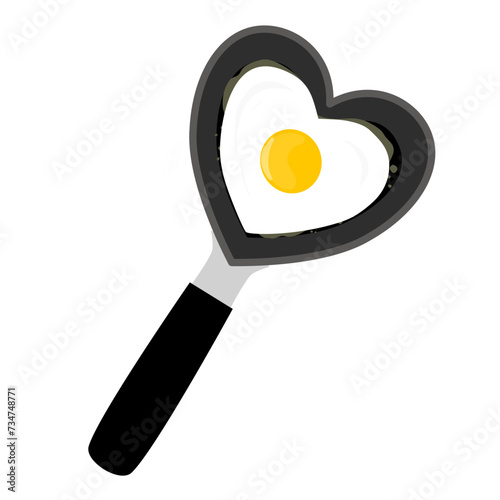 cute heart shaped fried egg on the frying pan