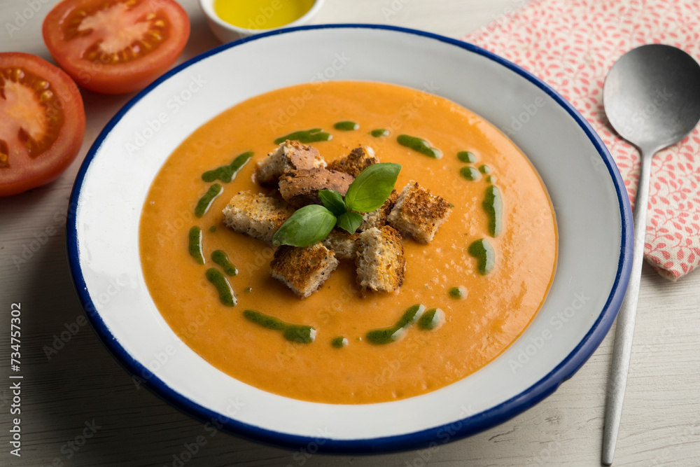 Spanish tomato soup with basil oil. Spanish tomato soup with basil oil.
