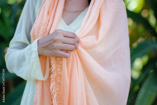 lady draping peach pashmina shawl photo