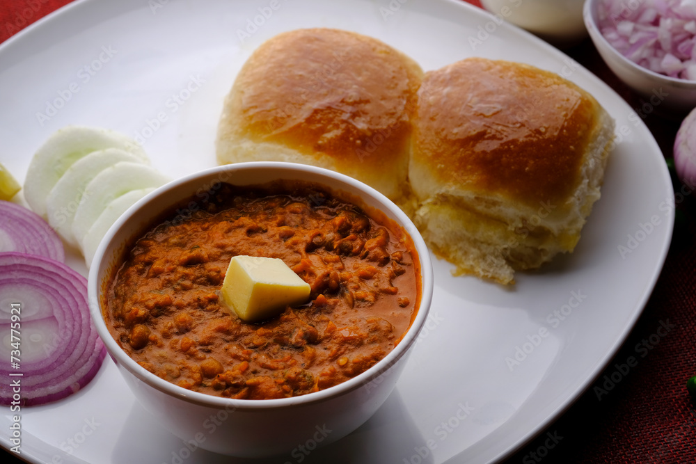 Pav bhaji is a fast food dish from India consisting of a thick vegetable curry served with bread. Pav bhaji is a fast food dish from India consisting of a thick vegetable curry served with bread.