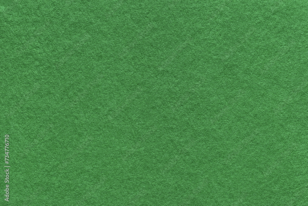 Texture of green and olive colors paper background, macro. Structure of dense craft cardboard. Texture of green and olive colors paper background, macro. Structure of dense craft cardboard.
