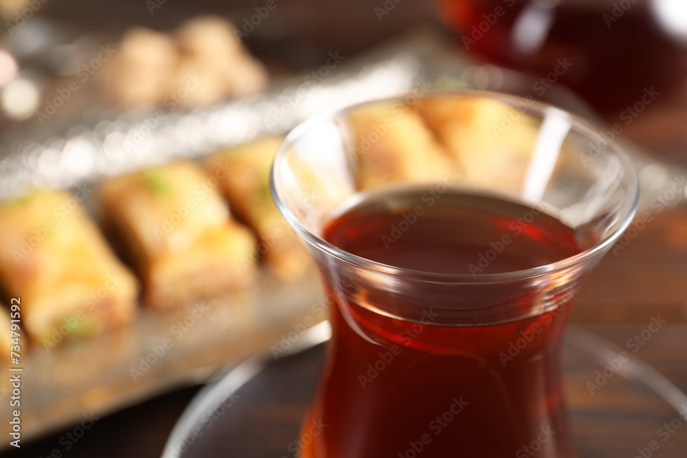 Traditional Turkish tea in glass on table, closeup. Space for text Traditional Turkish tea in glass on table, closeup. Space for text