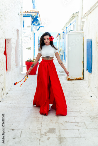 vacation mood. brunette woman in red summer dress