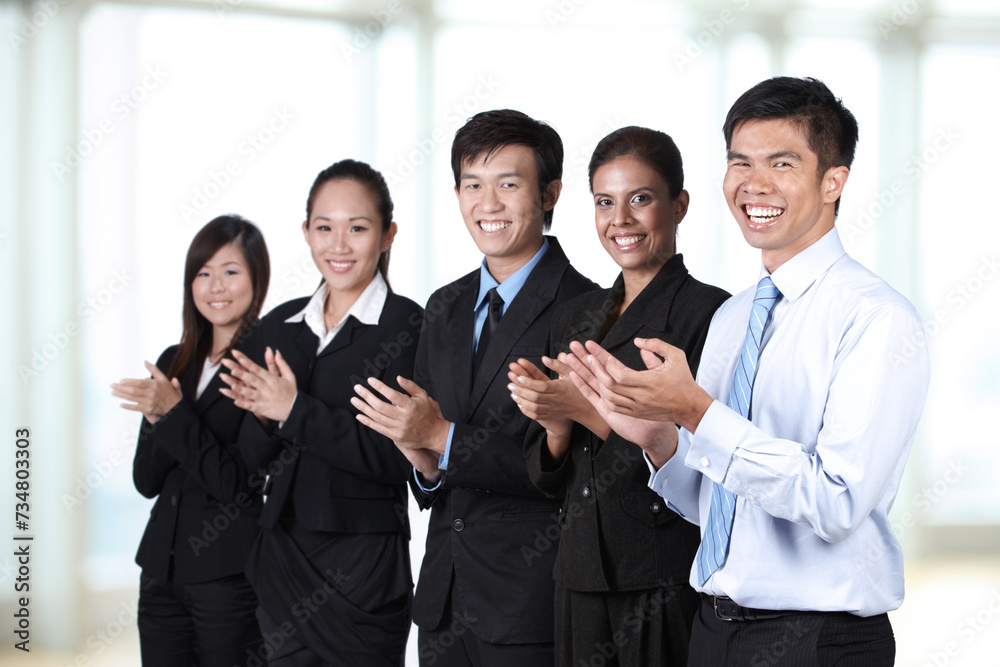 happy businesspeople clapping in a meeting happy businesspeople clapping in a meeting