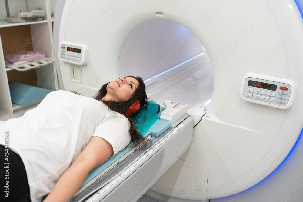 Medical CT or MRI Scan in the modern hospital laboratory. Interior of radiography department. Technologically advanced equipment in white room. Magnetic resonance diagnostics machine Medical CT or MRI Scan in the modern hospital laboratory. Interior of radiography department. Technologically advanced equipment in white room. Magnetic resonance diagnostics machine