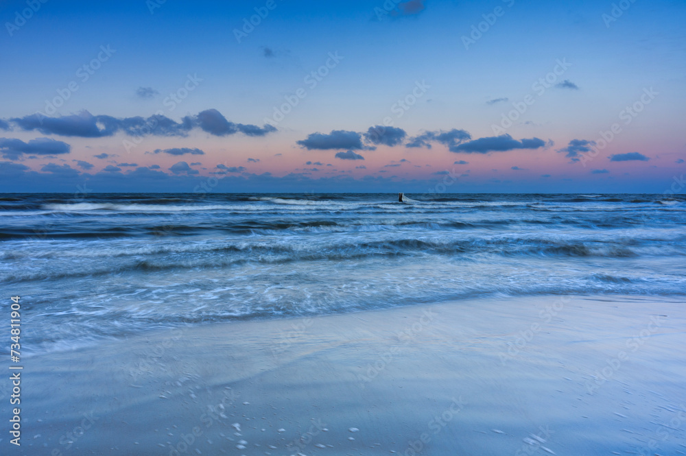 Winter sunset over the Baltic Sea in Jantar, Poland Winter sunset over the Baltic Sea in Jantar, Poland