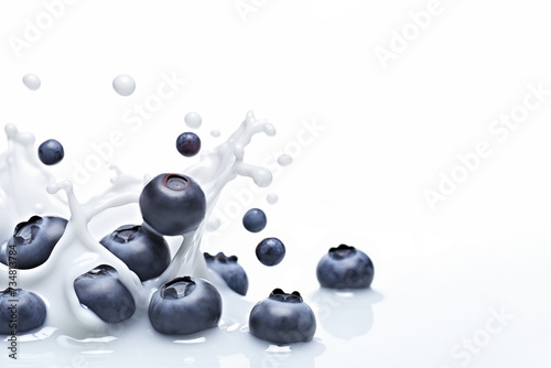 Blueberry in splash of milk isolated on white background.