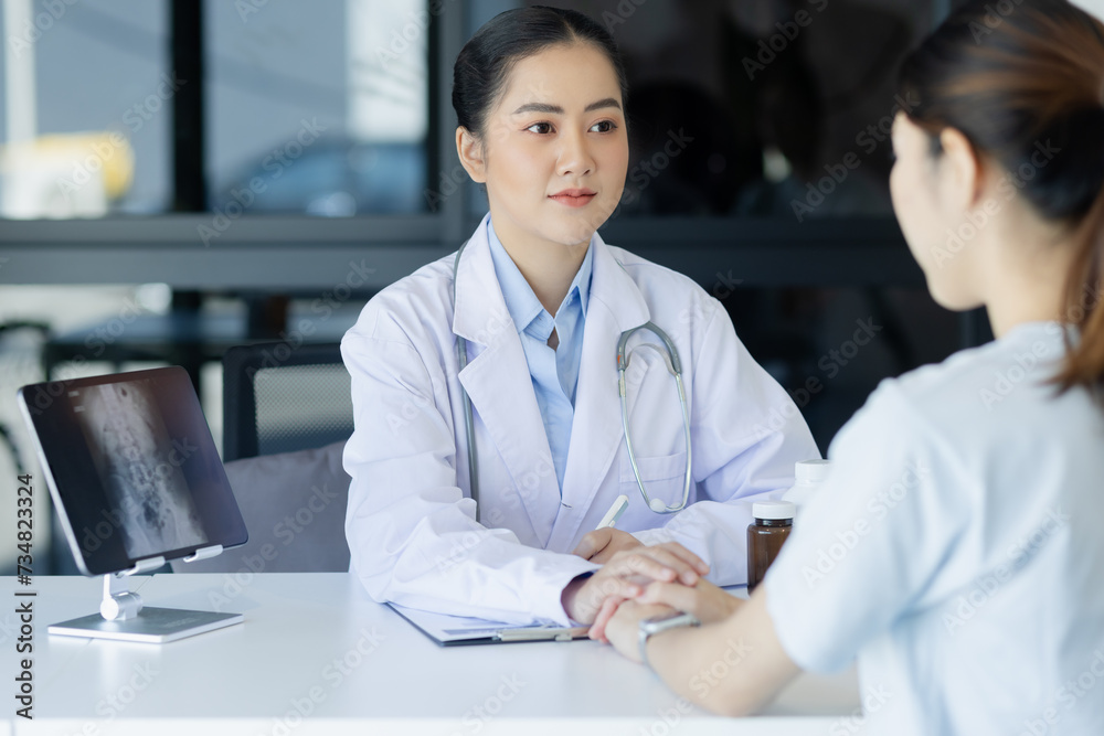 Asian female doctor explain to patient indoors office, healthcare and medical concept. Asian female doctor explain to patient indoors office, healthcare and medical concept.